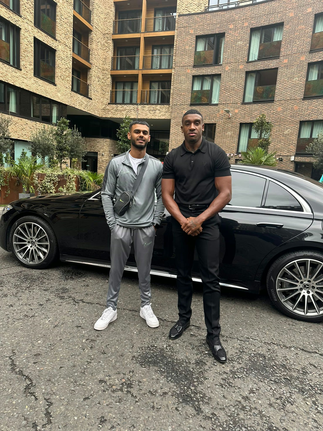 Rahul with Bugzy Malone outside the shop